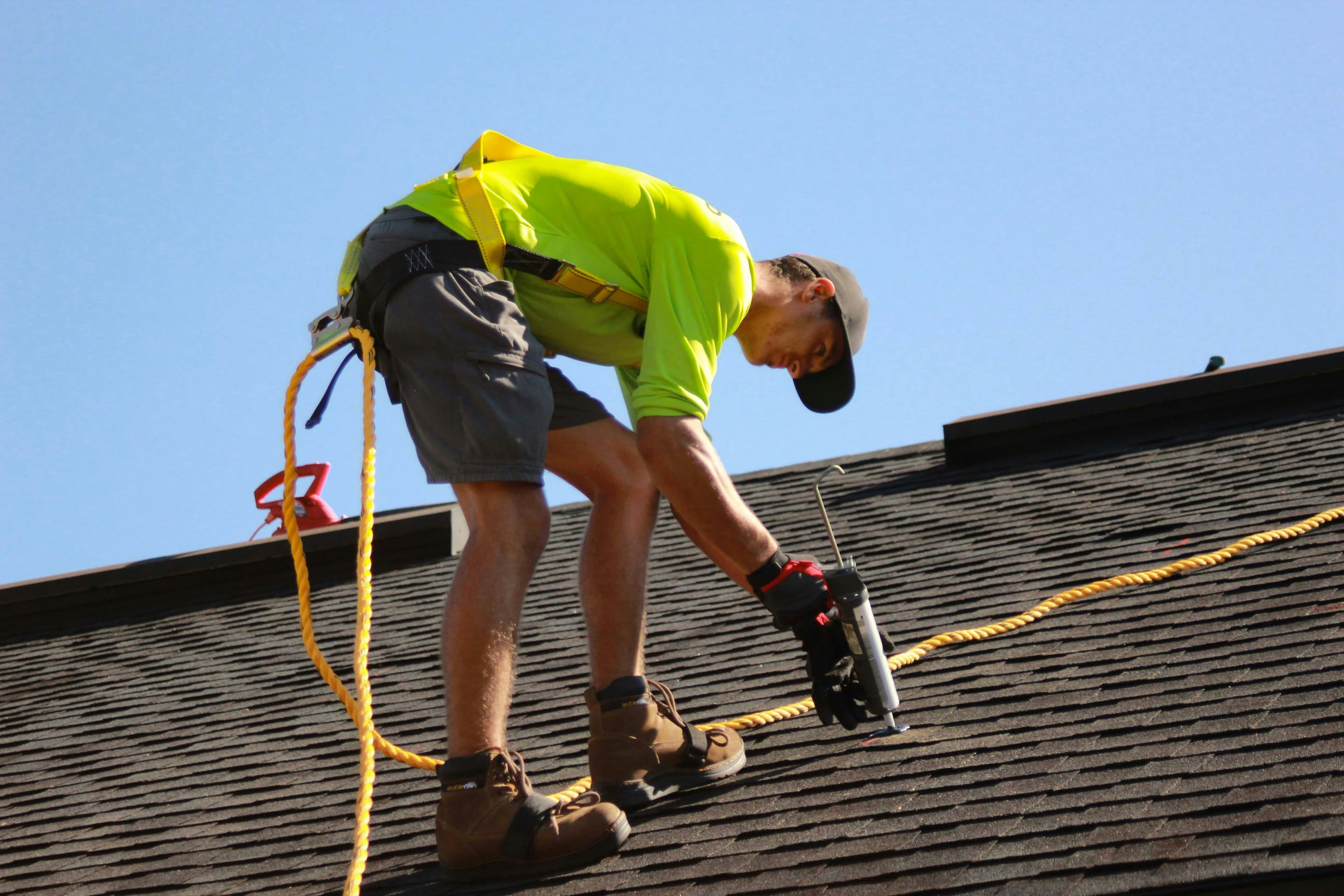 A roofing crew working on a residential roof.